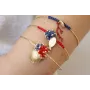 Pulsera rigida dorada brillo con nudo macramé rojo