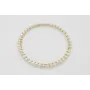Pulsera rigida dorada con perlas naturles cosidas 