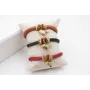 Pulsera de seda rellena color cobrizo con aritos d