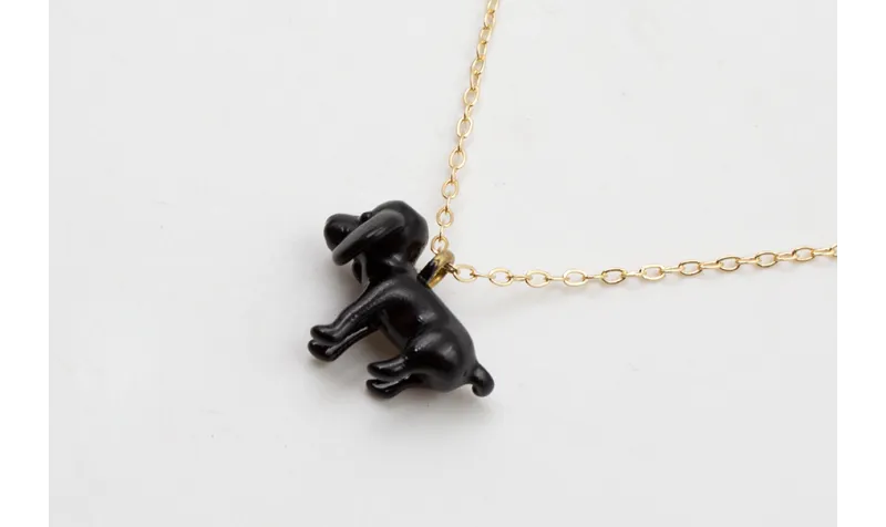 Solitario cadena eslabón pequeño dorado con perro