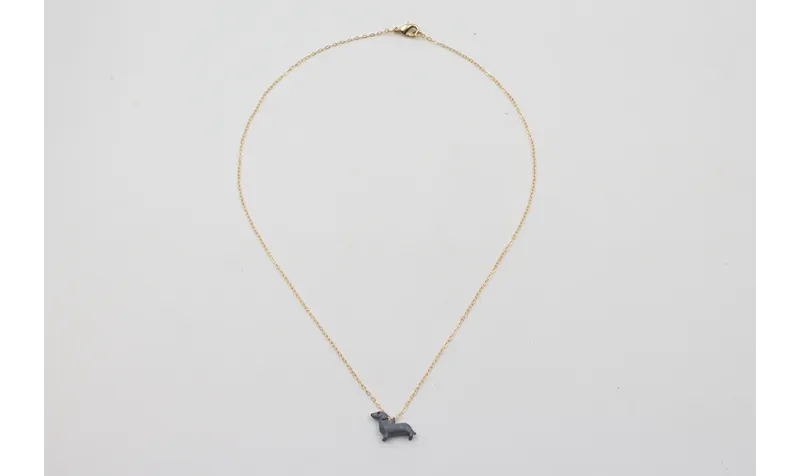 Solitario cadena eslabón pequeño dorado con perro