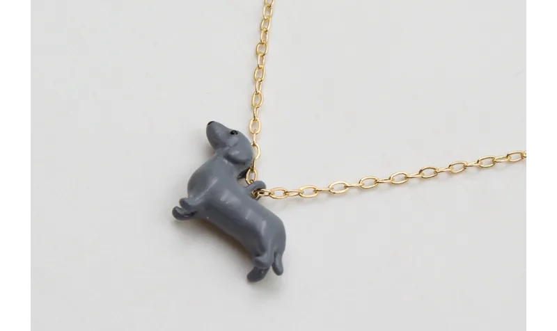 Solitario cadena eslabón pequeño dorado con perro