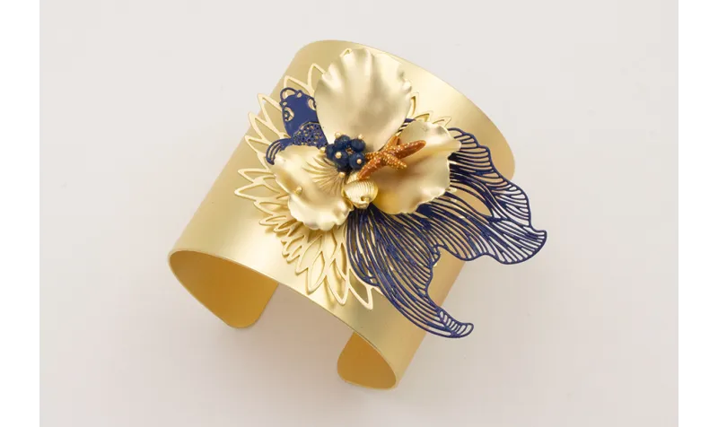 Brazalete rigido flor de loto,pez tropical azul os