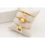 Pulsera hilo metalido dorado palido con nudo macra