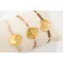 Pulsera ORO 18K. Hilo marrón con nudo serpiente co