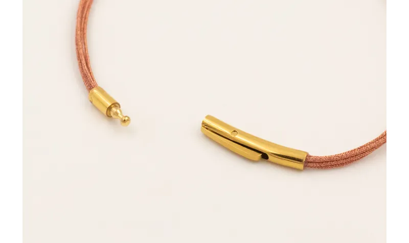 Pulsera hilo metalico oro rosa con tubo curvado ac