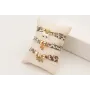Pulsera lazo liberty tonos marrones con discoa dor