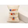 Pulsera hilo metalico dorada palido con burruño fa