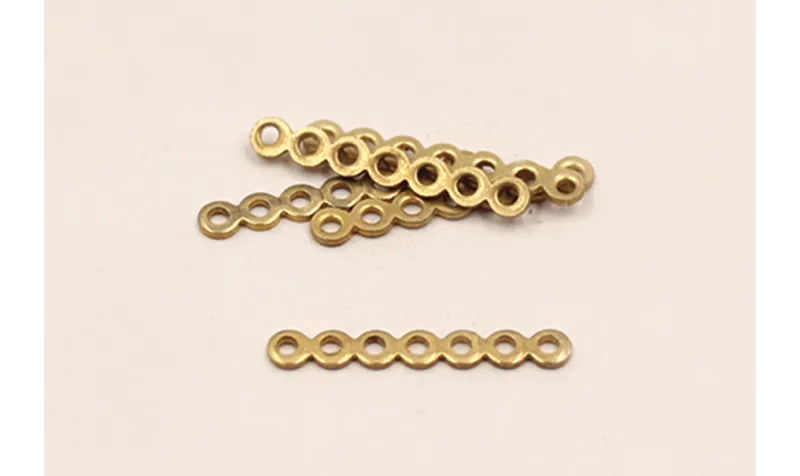 Separador plano 9 agujeros 23mm Oro / Separadores de Latón / Zamak