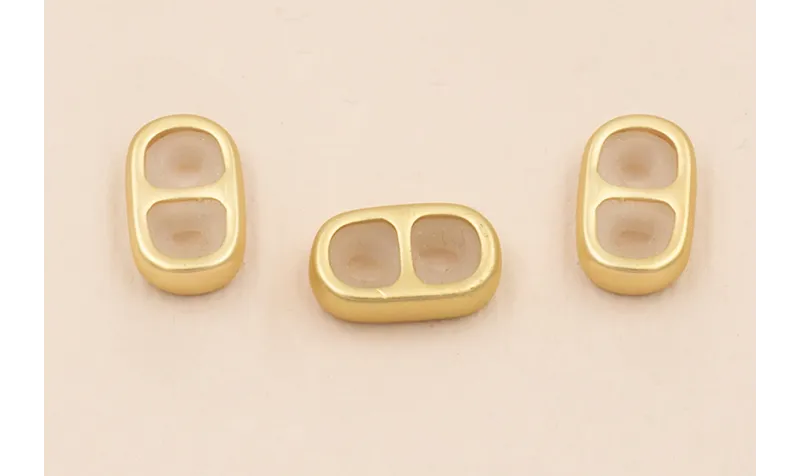 Terminal 2 agujeros con silicona 13*7mm Oro Mate